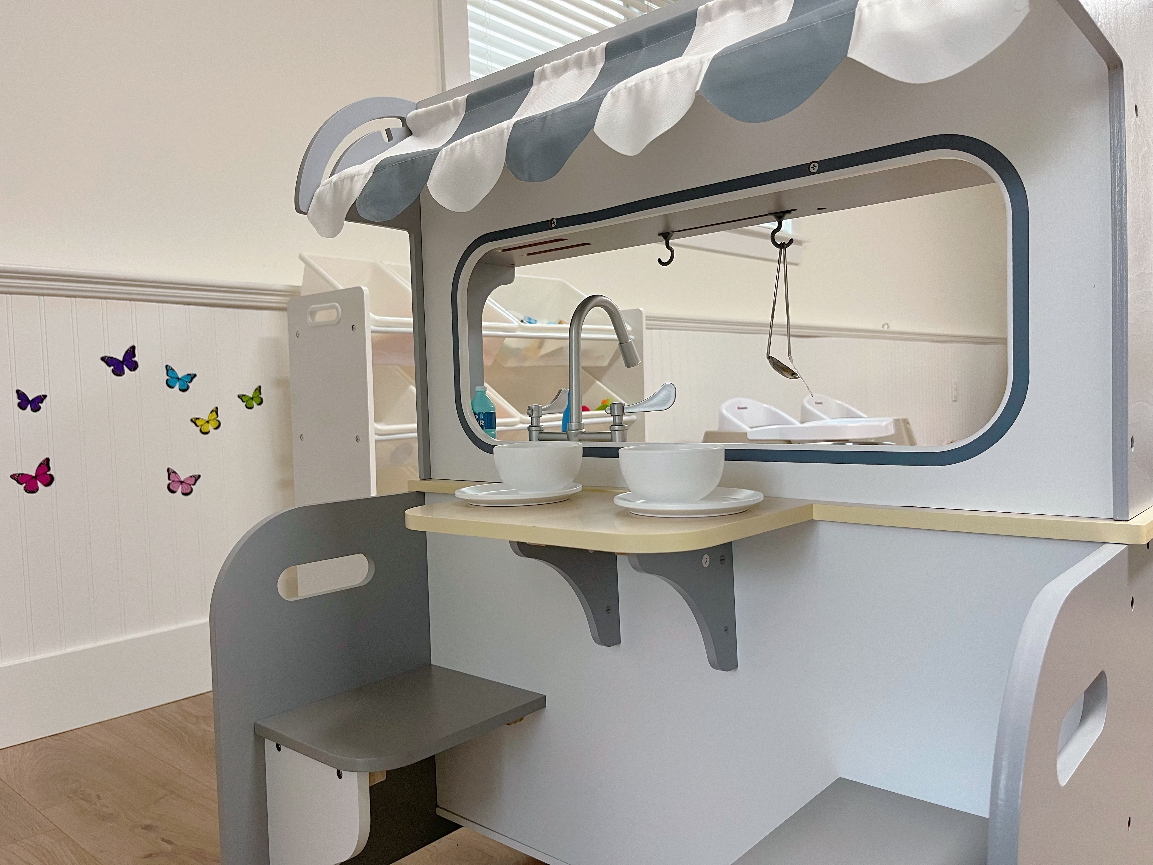 Children playing in the kitchen area